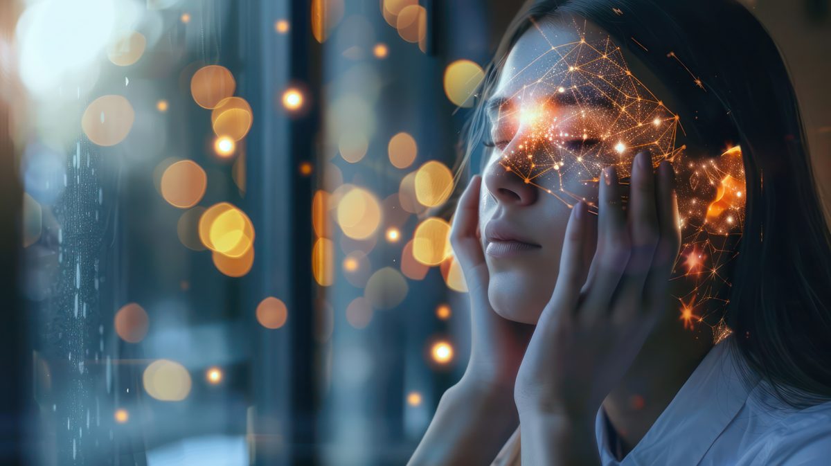 Woman with hands at her temples and a glowing neural network over her face