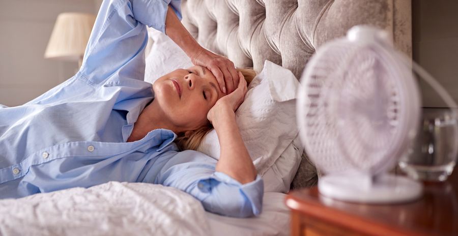 Woman experiencing a hot flash symptom of menopause or perimenopause